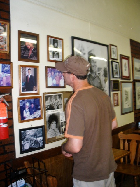 The Beloved checking out Snappy Lunch's Wall o' Fame.  We didn't recognize anyone except Donna Fargo.  She sang "The Happiest Girl in the Whole USA."