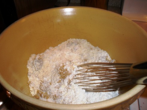 Whisking the dry ingredients together.  I had to use my hot little hands to crush the lumps out of the brown sugar.